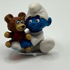 RETIRED RARE Schleich Baby Smurf With Bear NEW With tags  Approx 1 Inch